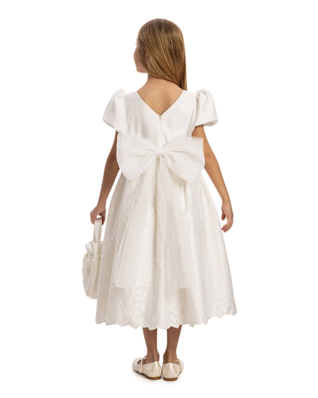 White dress with a large bow on a white background