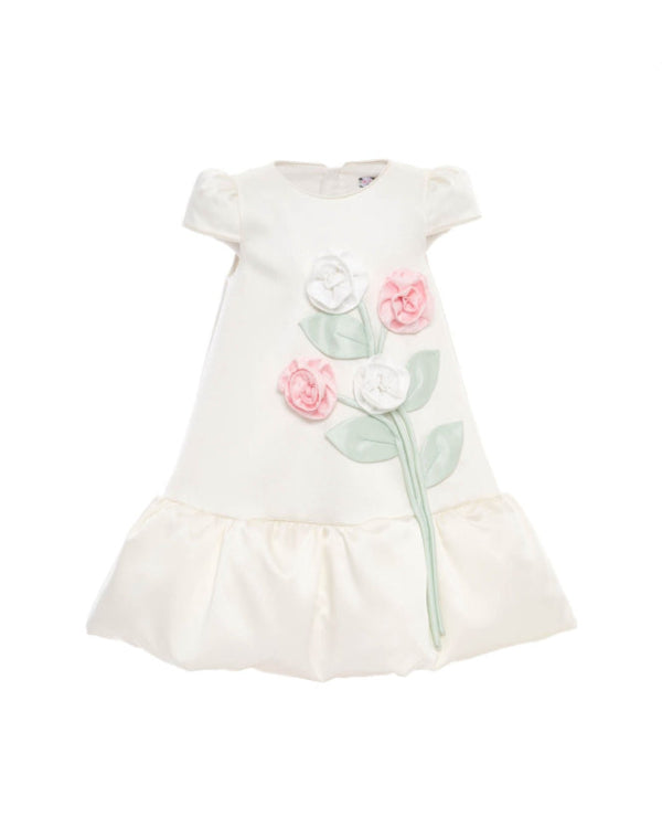 White dress with floral designs on a white background