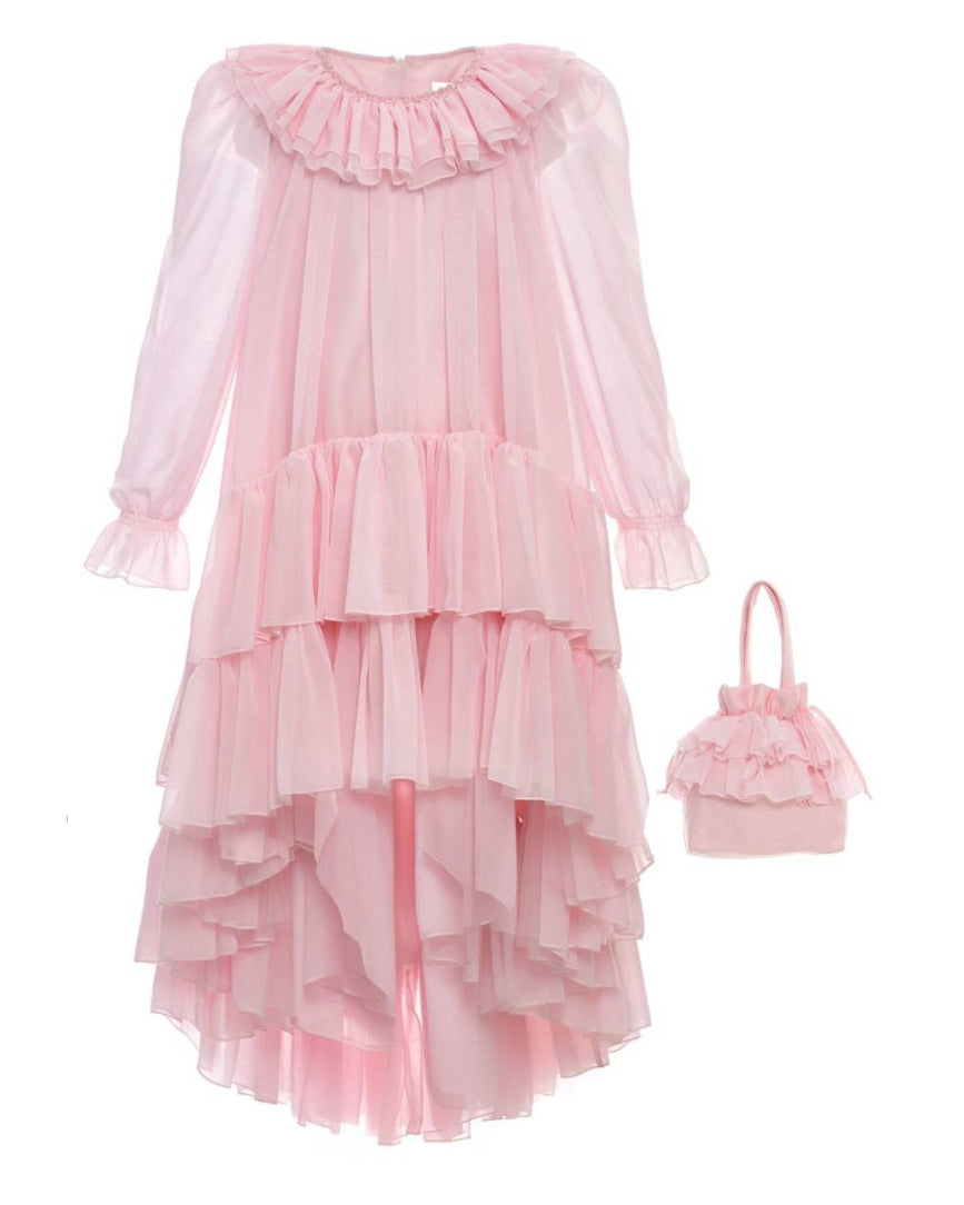 Pink ruffled dress with matching handbag on a white background