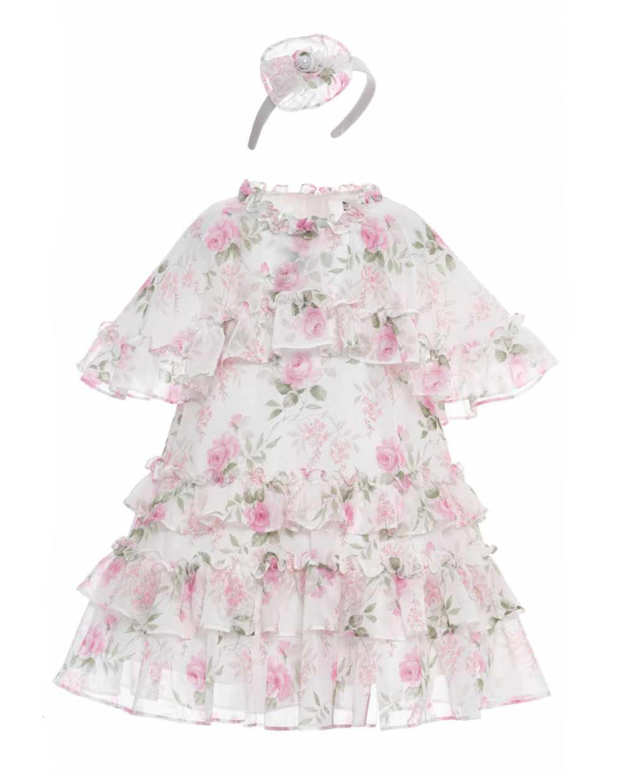 Floral dress with ruffles and matching headband on a white background