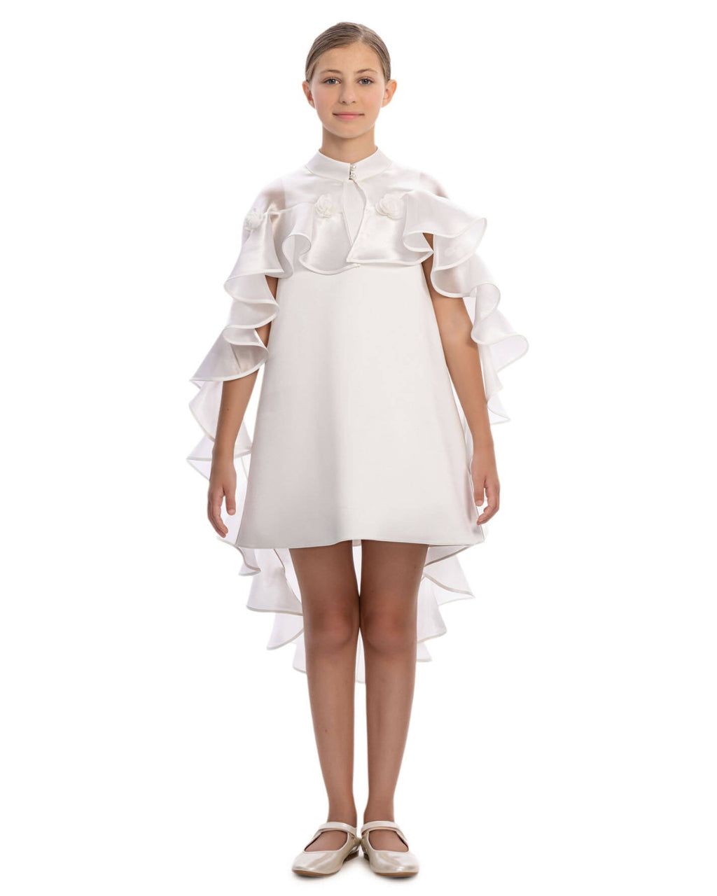 White dress with ruffled sleeves and hem on a white background