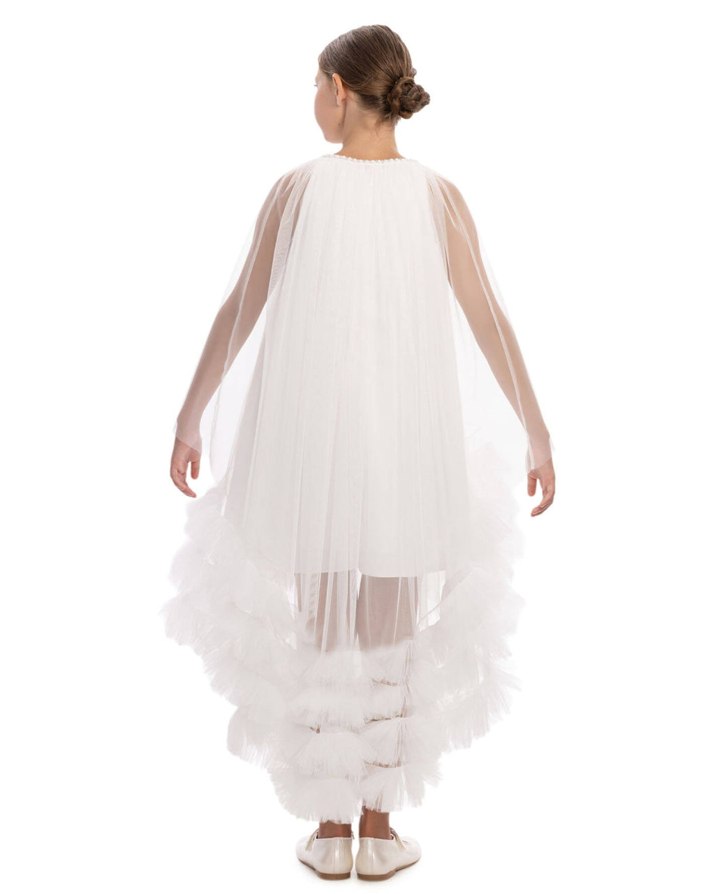 White dress with sheer sleeves and ruffled bottom on a white background