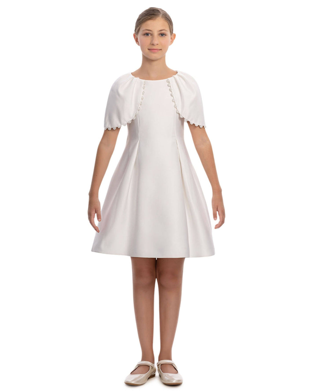 White dress with short sleeves and lace details on a white background