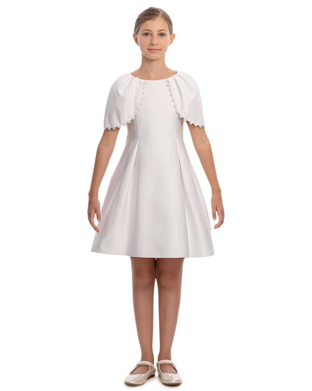White dress with short sleeves and lace details on a white background