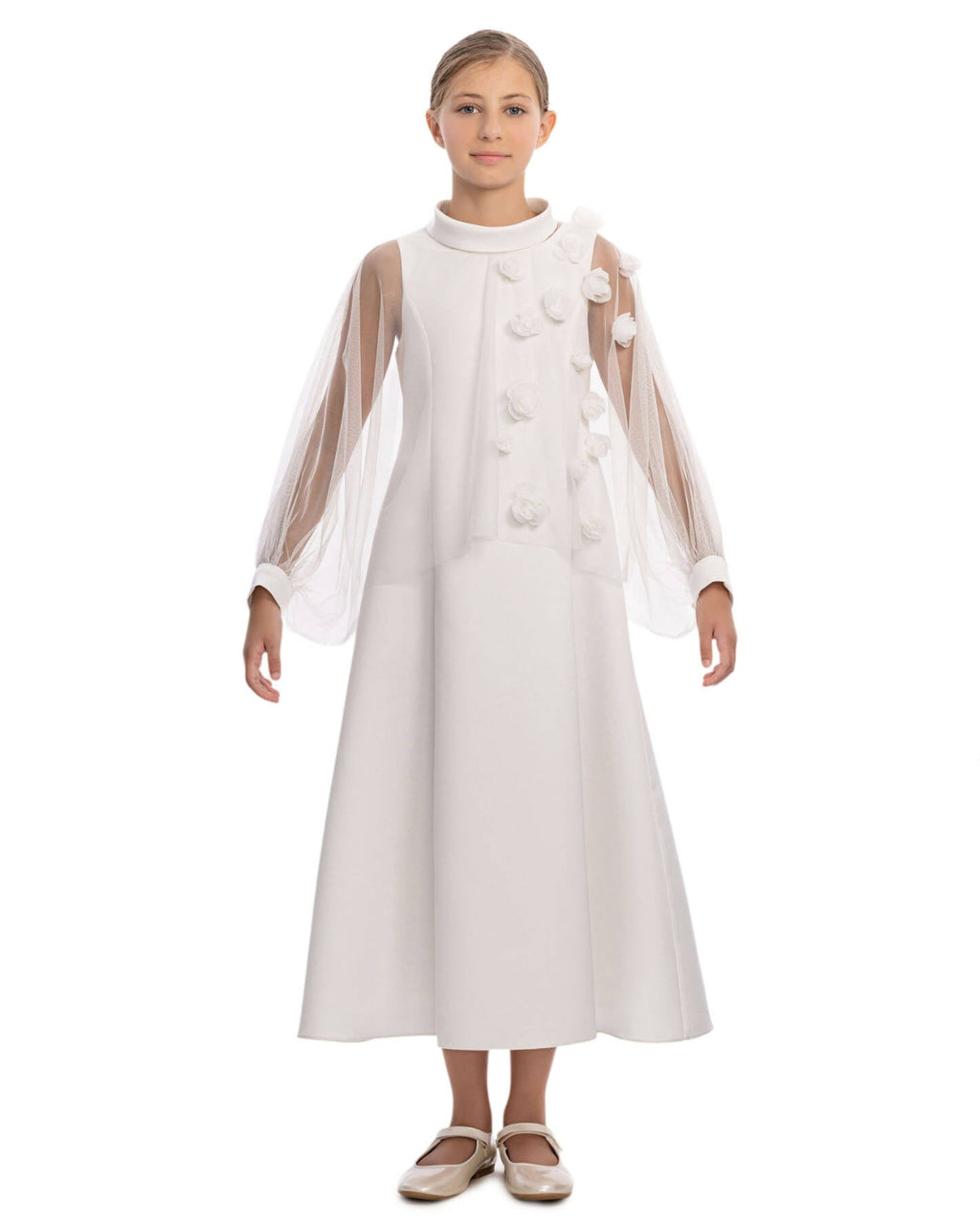 White dress with sheer sleeves worn by a model on a white background
