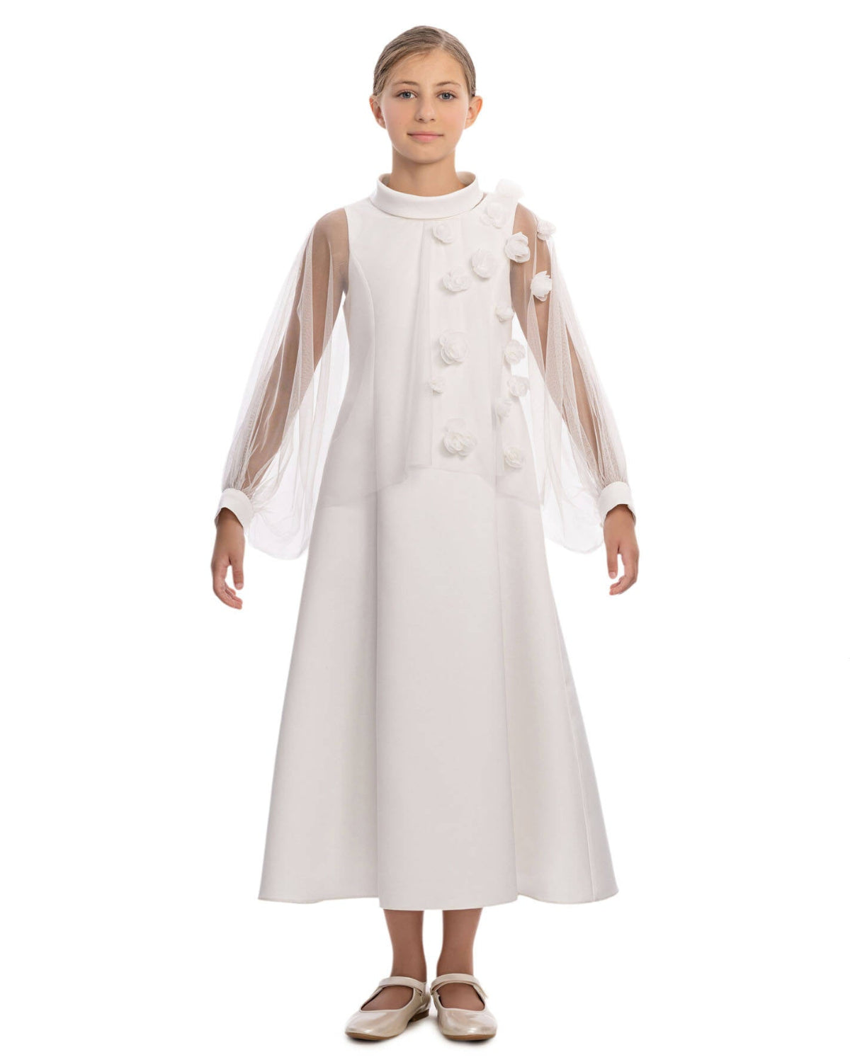 White dress with sheer sleeves worn by a model on a white background